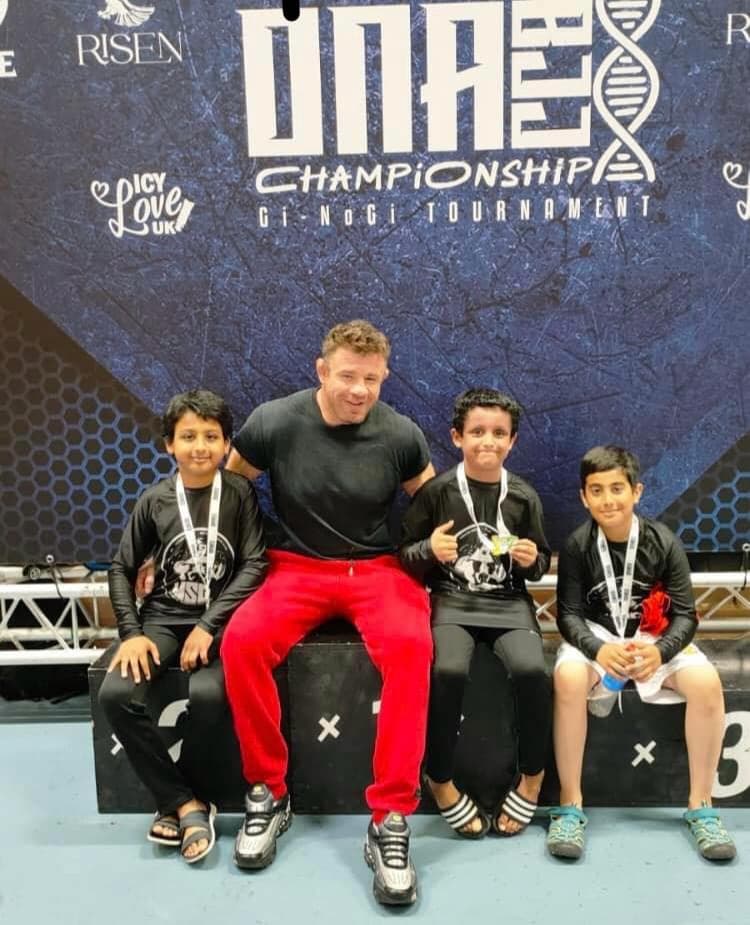 DNA Championship podium with medals